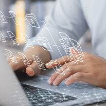 Man typing on laptop