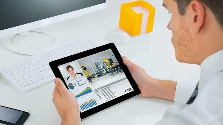 A person views digital content about industrial automation on a tablet